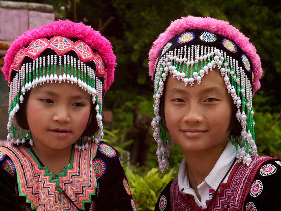Two Girls In Traditional Garb Near Chang Mai, Thailand
