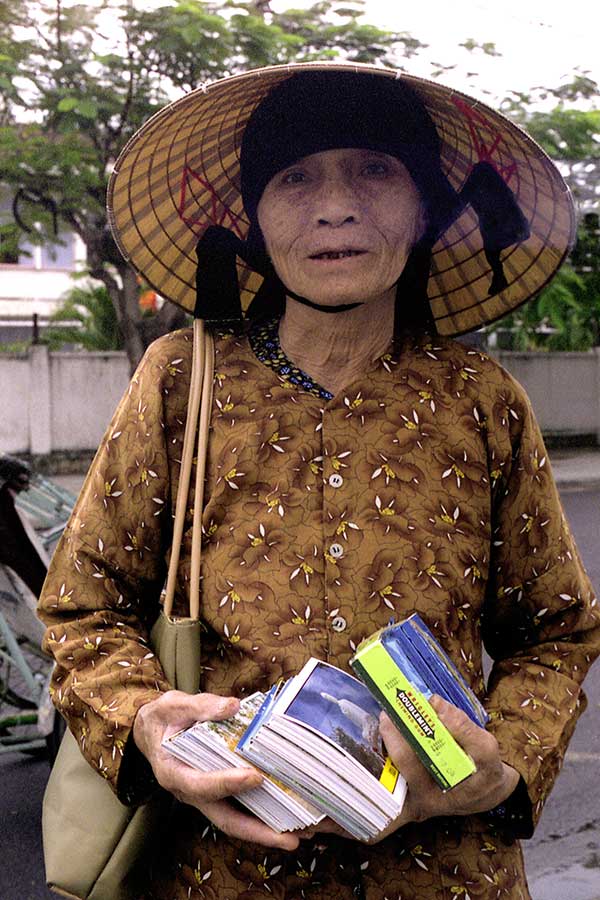 Woman Selling Post Cards and Chewing Gum in Nha Trang, Viet Nam