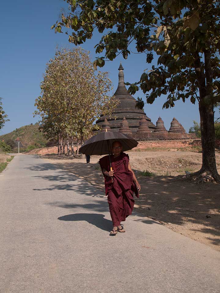 Buddhist Monk With a Parasol in Mrauk U, Myanmar