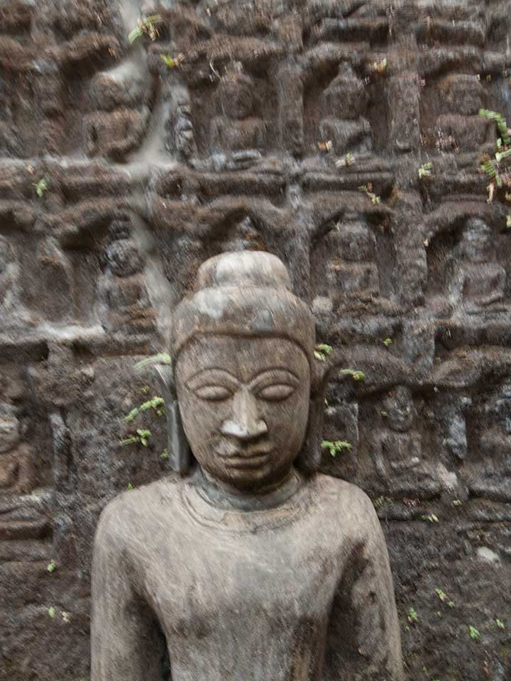 Stone Buddha and Carved Wall in Mrauk U, Myanmar